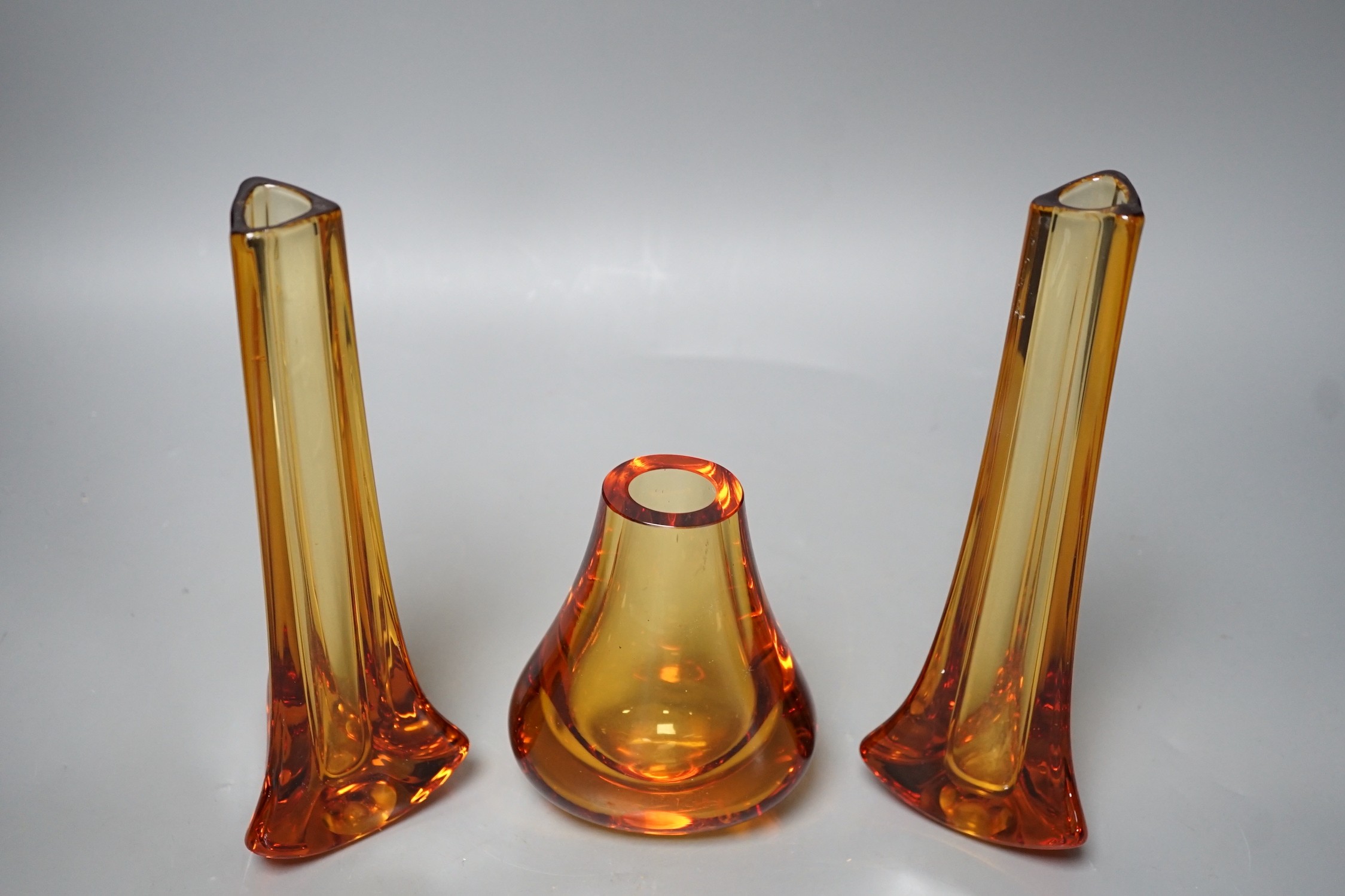 Whitefriars glass - a pair of amber coloured vases and another, 23.5cm